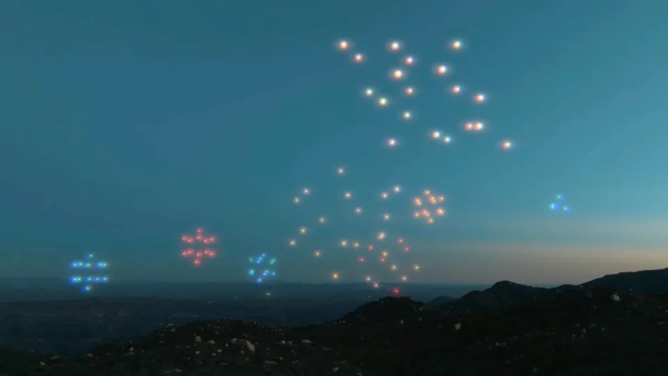 A light show from Drone Studios shows the aerial decorations displayed by the machines' colorful pixels.